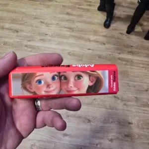 Photograph of the image I generated of my daughter and wife in a pixar style on an Adobe Express Tony's chocolate bar.